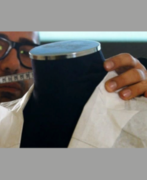 a person holding a cup