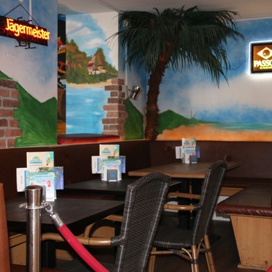 a chair sitting in front of a restaurant