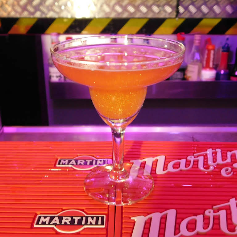 a bottle of wine and a glass of beer on a table